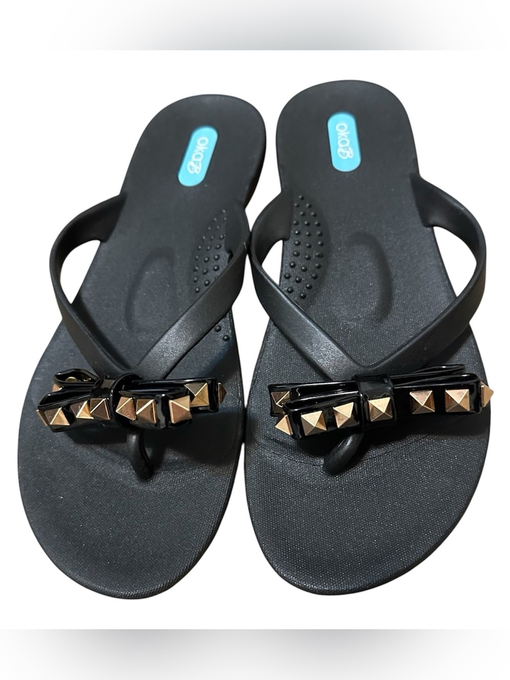 Oka-B "Chase" flip-flops in black with bow and gold studs size 7